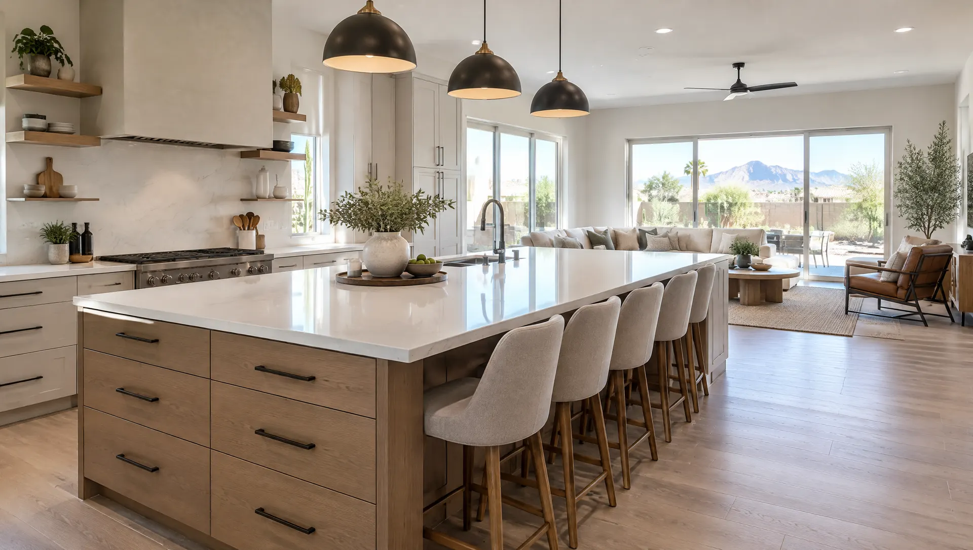 Large kitchen island with seating for four, a quartz top with overhang, pendant lights and storage drawers, in an open-concept room