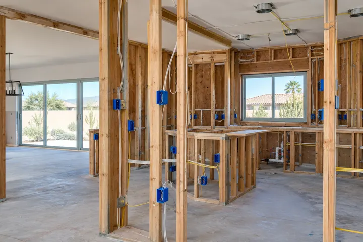 New electrical boxes and wiring for kitchen outlets and lighting in open walls before drywall